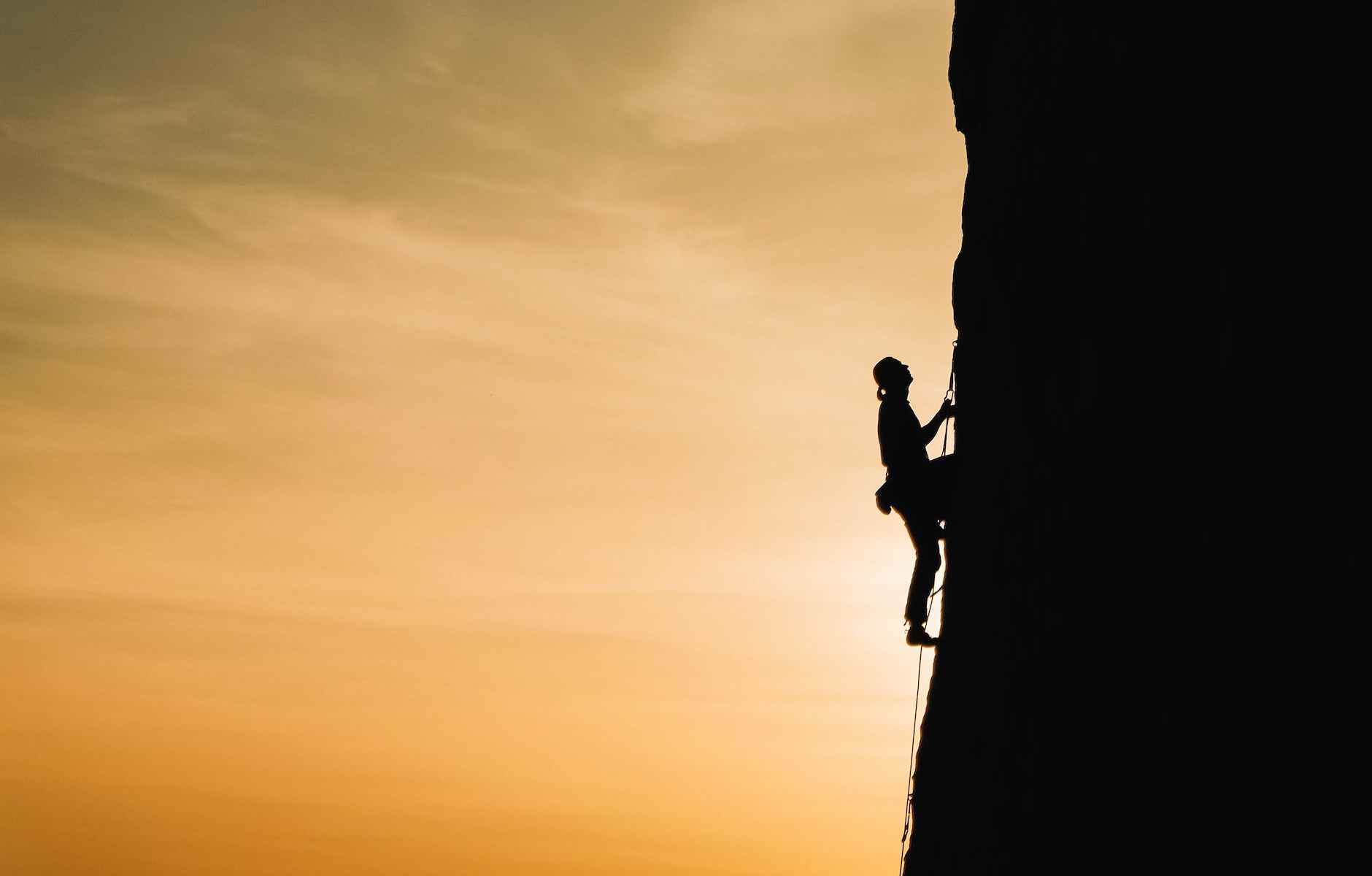 person rock climbing