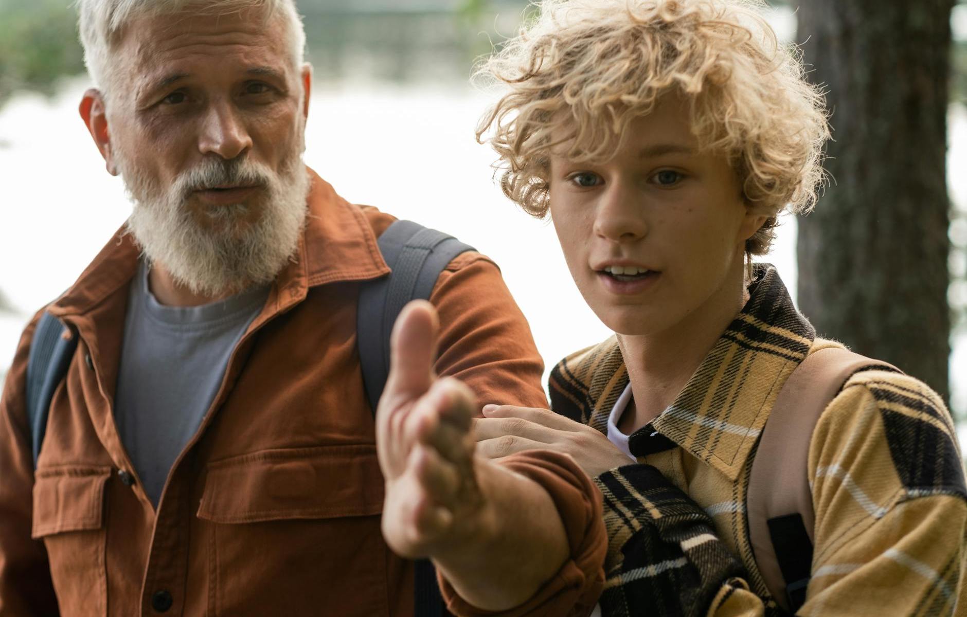 grandfather hiking with grandson