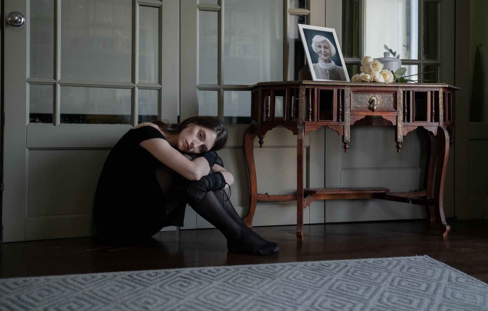 an emotional woman sitting on the floor